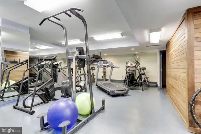 a living room with lots of furniture and a chandelier