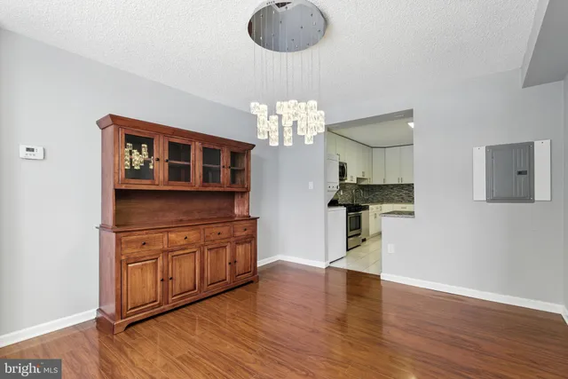 a kitchen with stainless steel appliances granite countertop a stove and cabinets