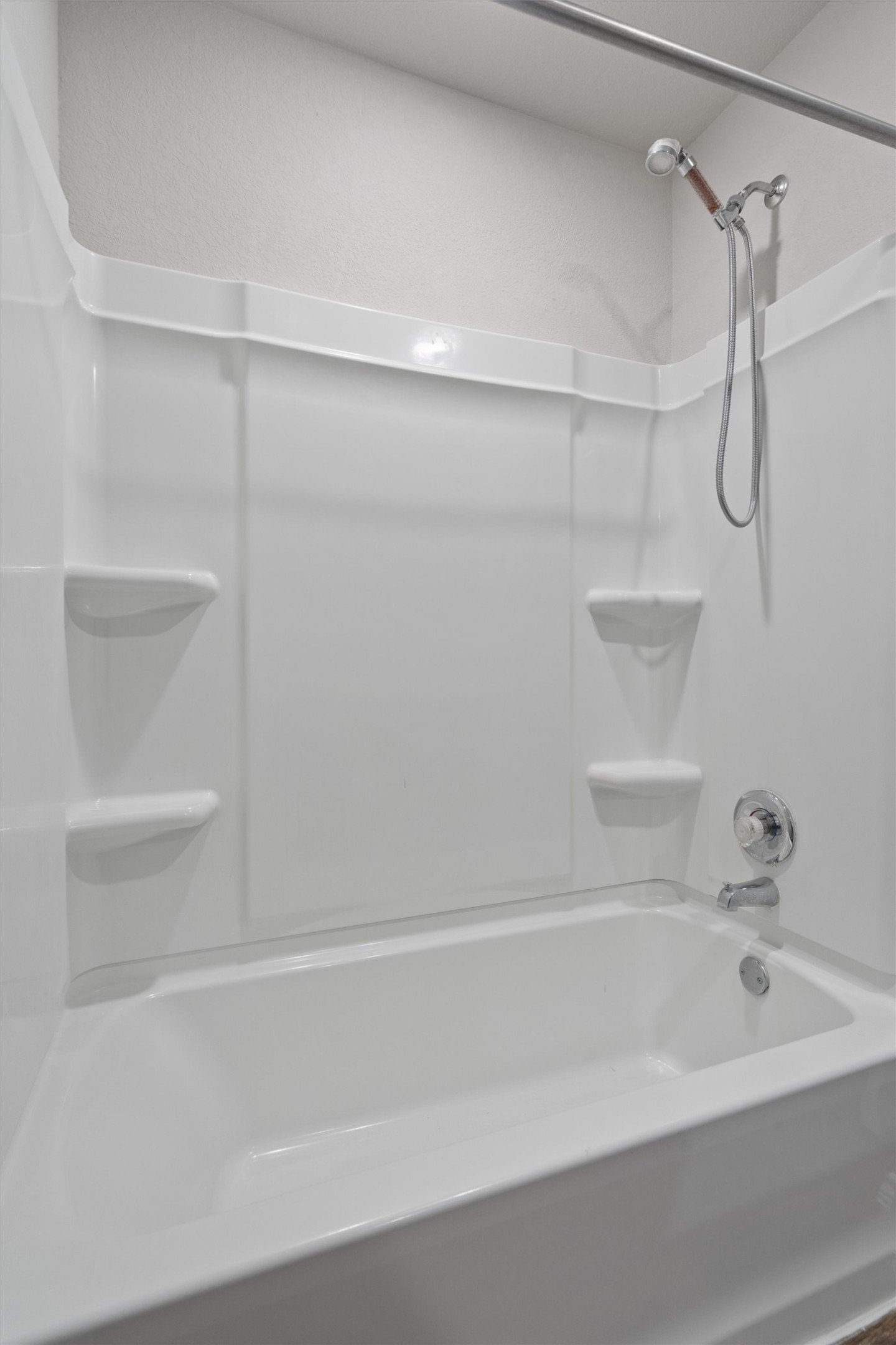 6121 Ronee Leah Drive Austin, TX 78724 - Photo 26 of 30 A pristine, all-white tub and shower combination offers a fresh start to your day.