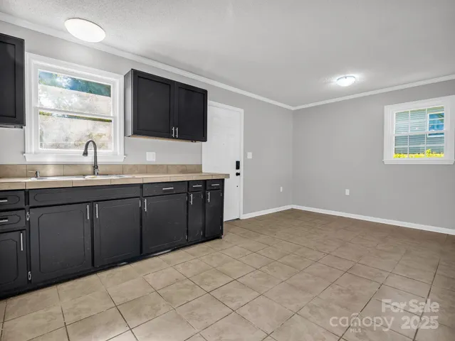 a kitchen with a sink and cabinets