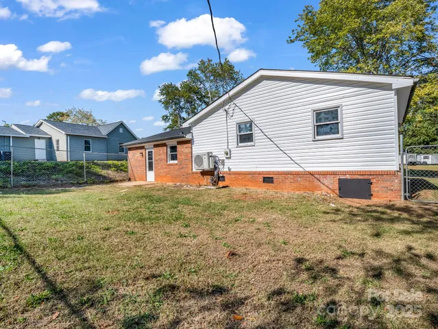 a backyard of a house with seating space
