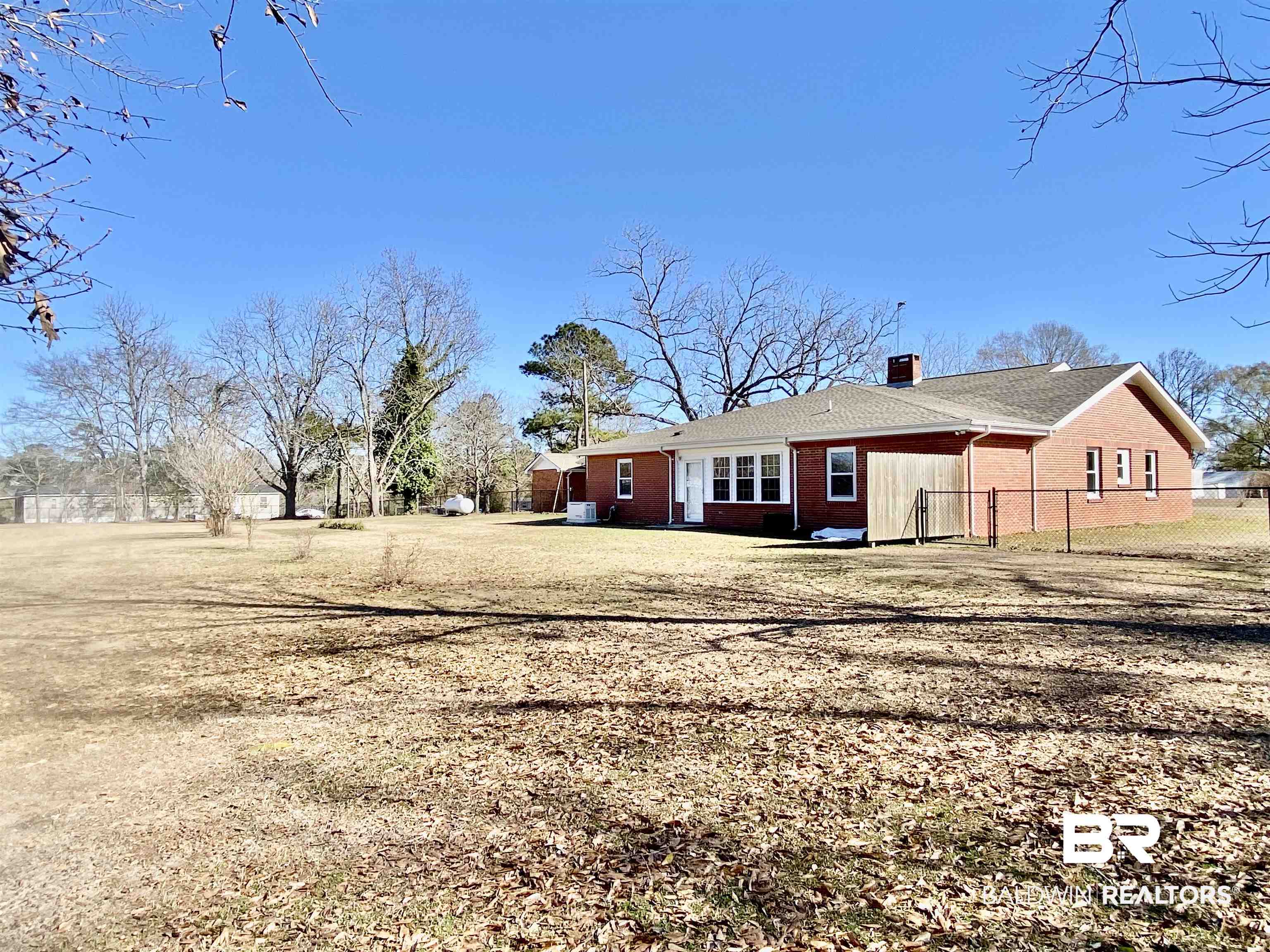 2711 County Road 5 Repton, AL 36475 - Photo 35 of 36 Rear view of property with a yard