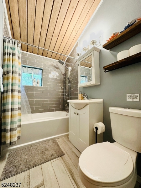 639 Canistear Road Vernon, NJ 07422 - Photo 11 of 23 a white toilet sitting next to a bathroom sink and tub