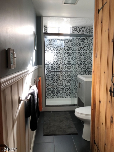 639 Canistear Road Vernon, NJ 07422 - Photo 18 of 23 a bathroom with a toilet and a shower