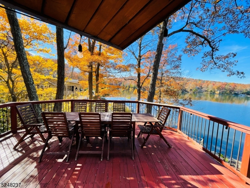 639 Canistear Road Vernon, NJ 07422 - Photo 22 of 23 a view of a balcony with chairs and wooden floor