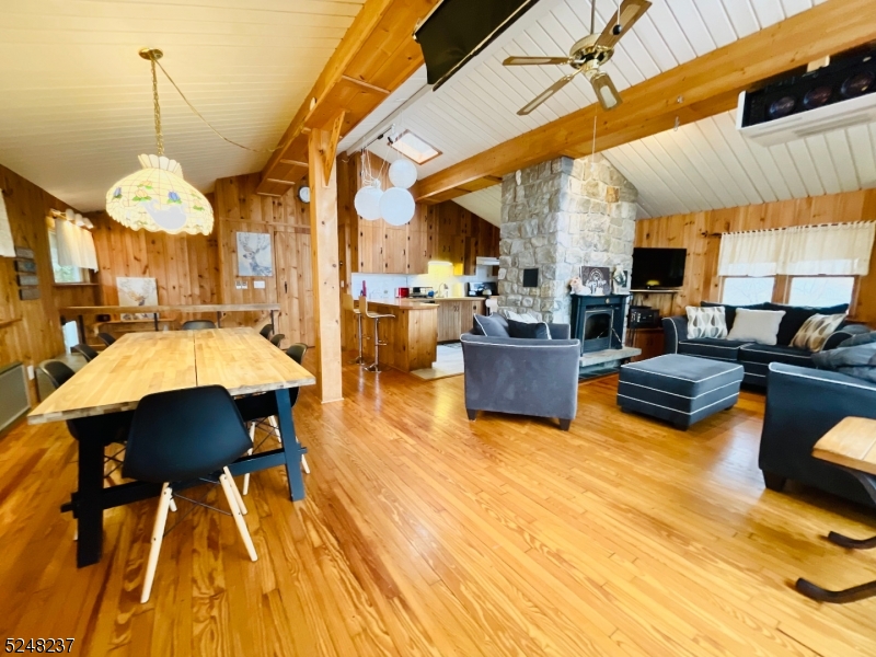639 Canistear Road Vernon, NJ 07422 - Photo 5 of 23 a living room with furniture and a chandelier