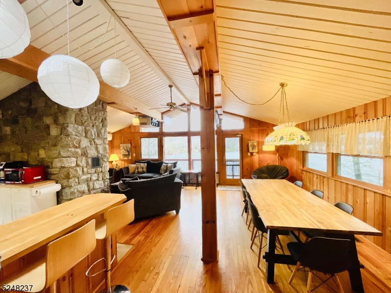 639 Canistear Road Vernon, NJ 07422 - Photo 6 of 23 a view of a dining room with furniture and wooden floor