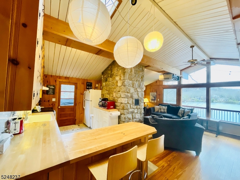 639 Canistear Road Vernon, NJ 07422 - Photo 9 of 23 a view of a dining room with furniture and a large window