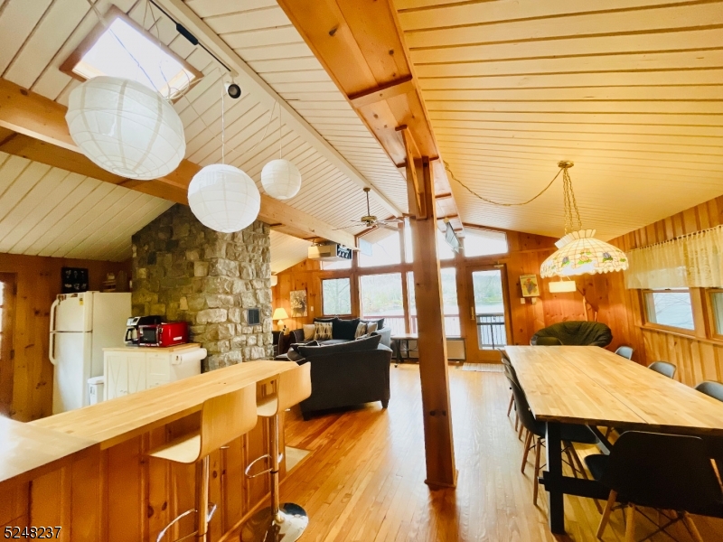 639 Canistear Road Vernon, NJ 07422 - Photo 10 of 23 a view of a dining room with furniture and wooden floor