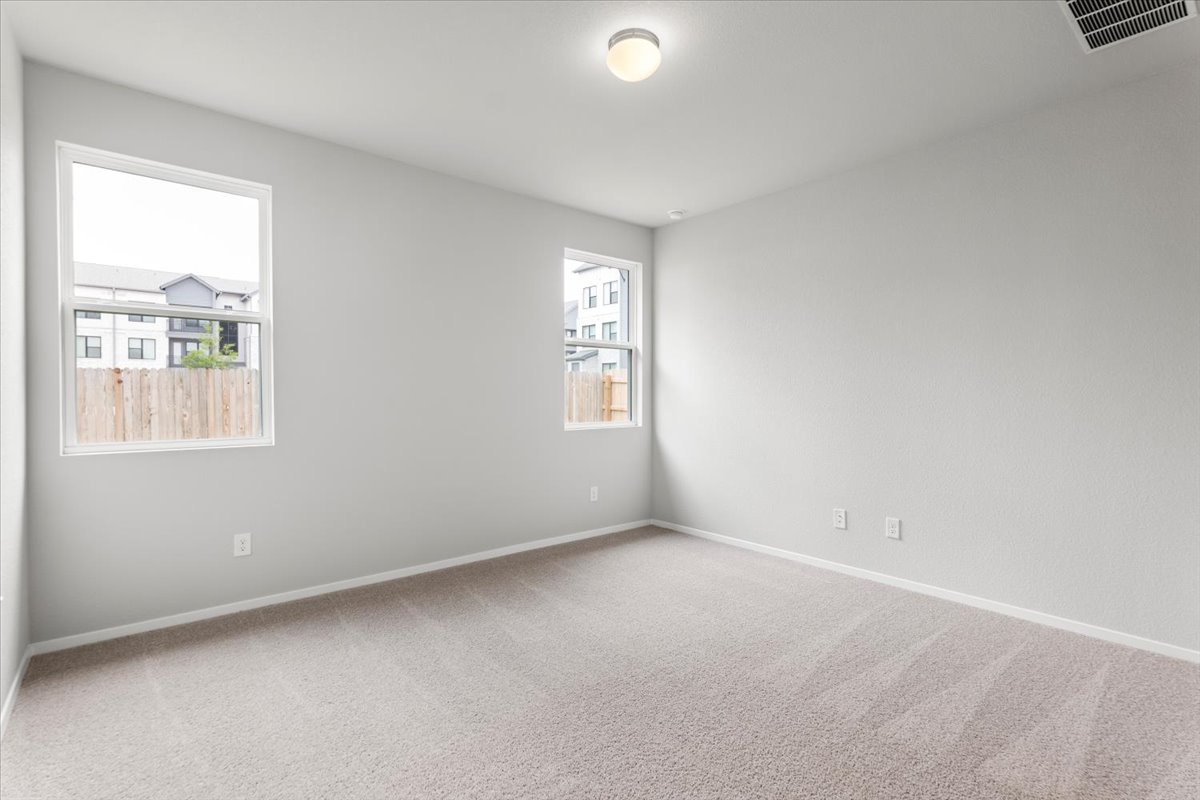 2603 Totley Road Manor, TX 78653 - Photo 16 of 37 Empty room with carpet and baseboards
