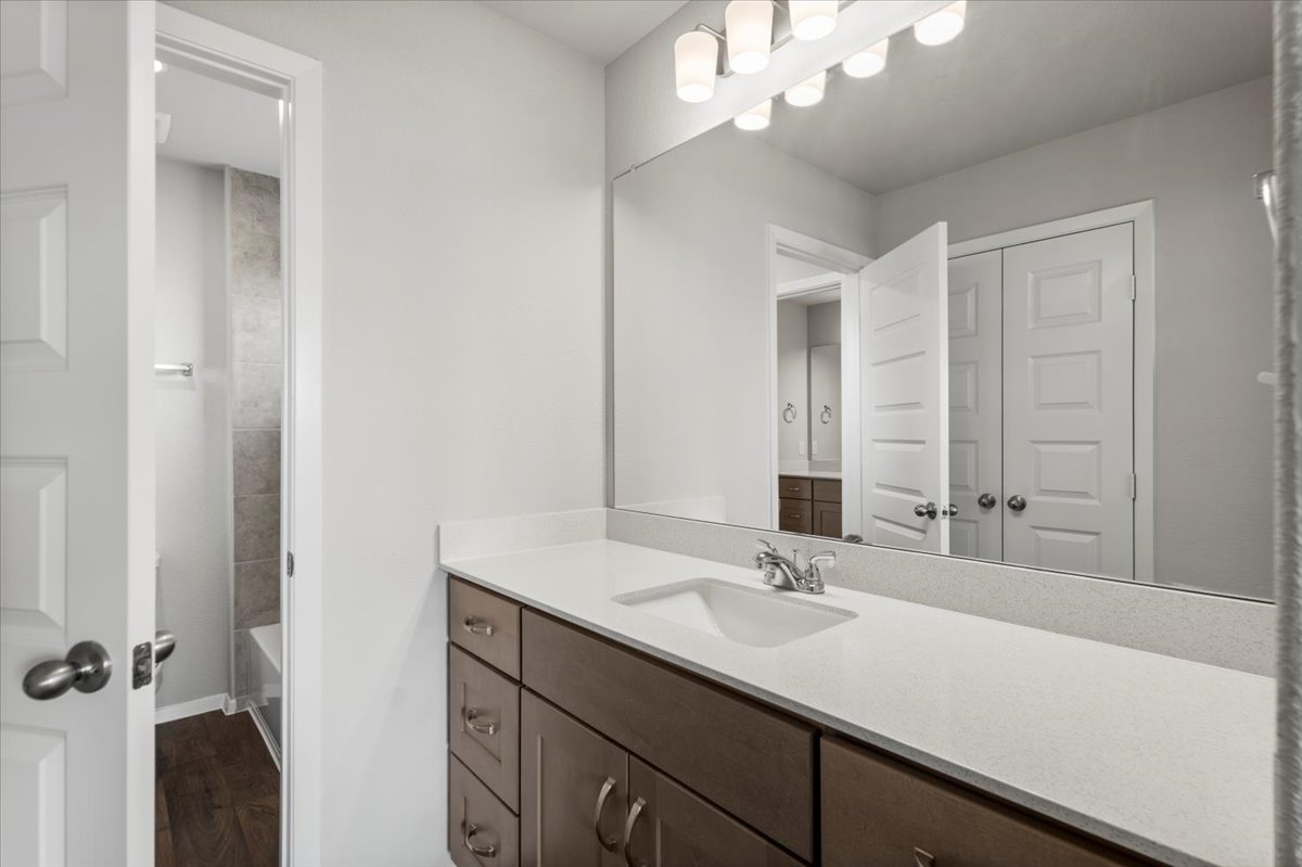 2603 Totley Road Manor, TX 78653 - Photo 26 of 37 Bathroom with vanity and wood finished floors