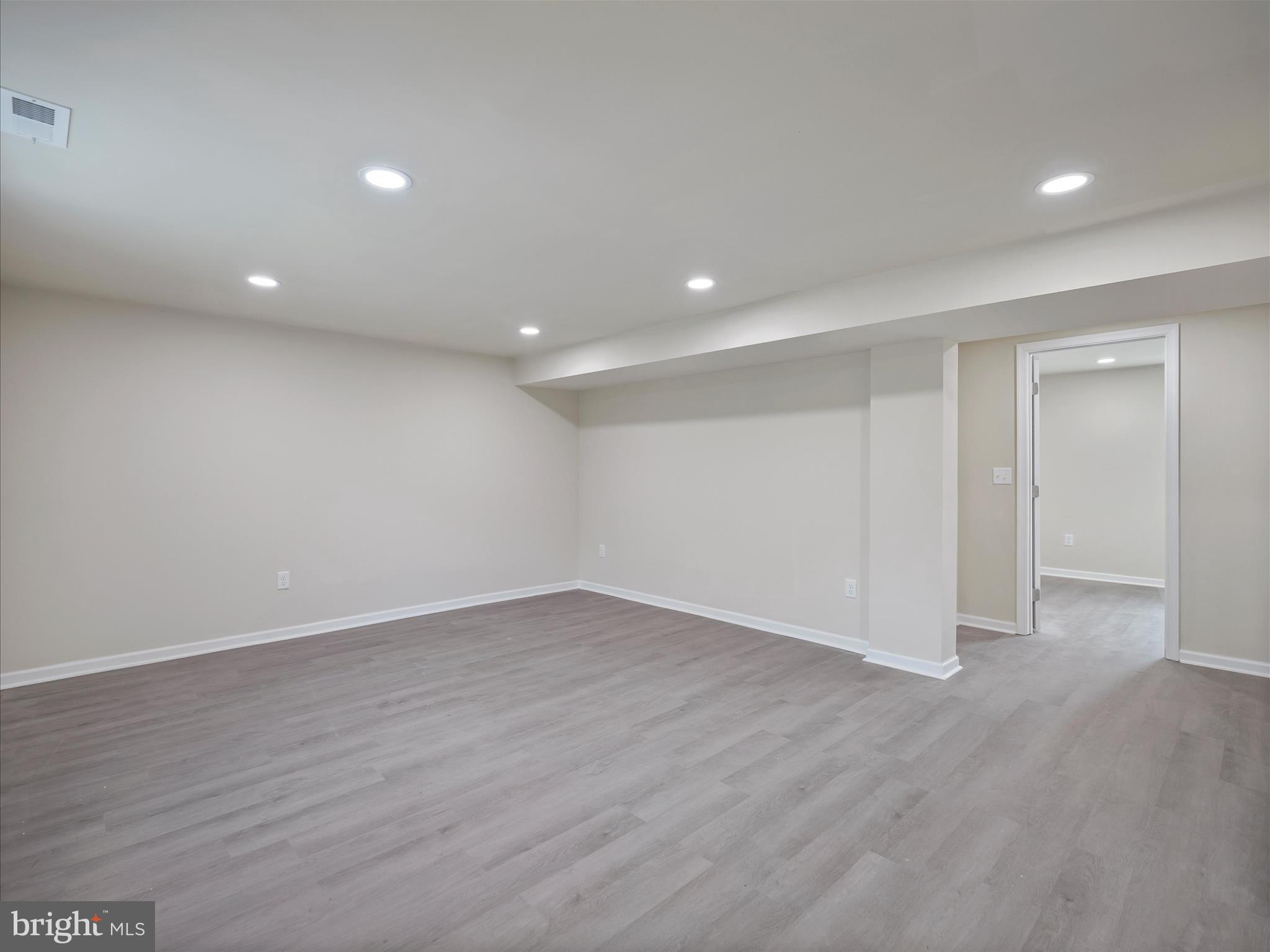809 Florida Avenue Hagerstown, MD 21740 - Photo 23 of 33 a view of an empty room with wooden floor