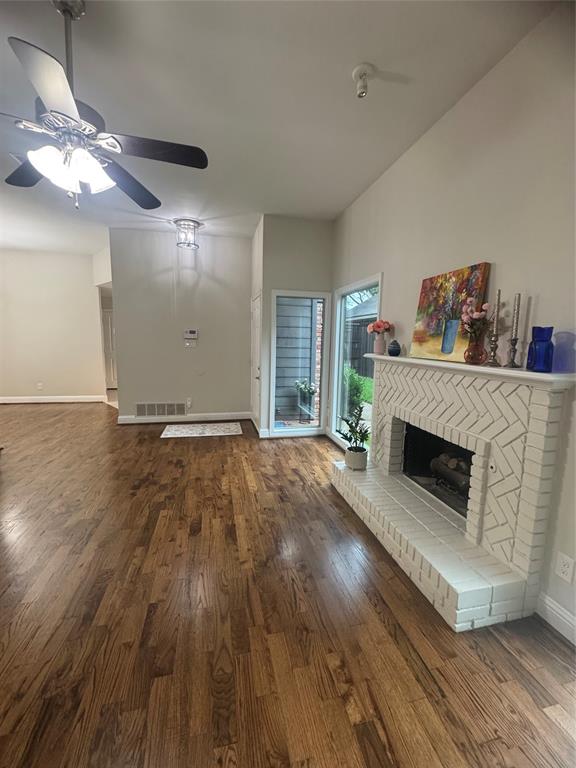 4010 Rive Lane Addison, TX 75001 - Photo 14 of 25 a living room with furniture and a fireplace