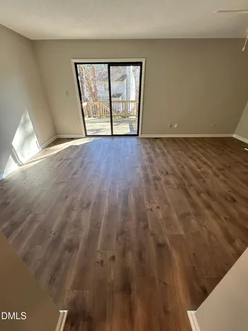 a view of a livingroom with wooden floor