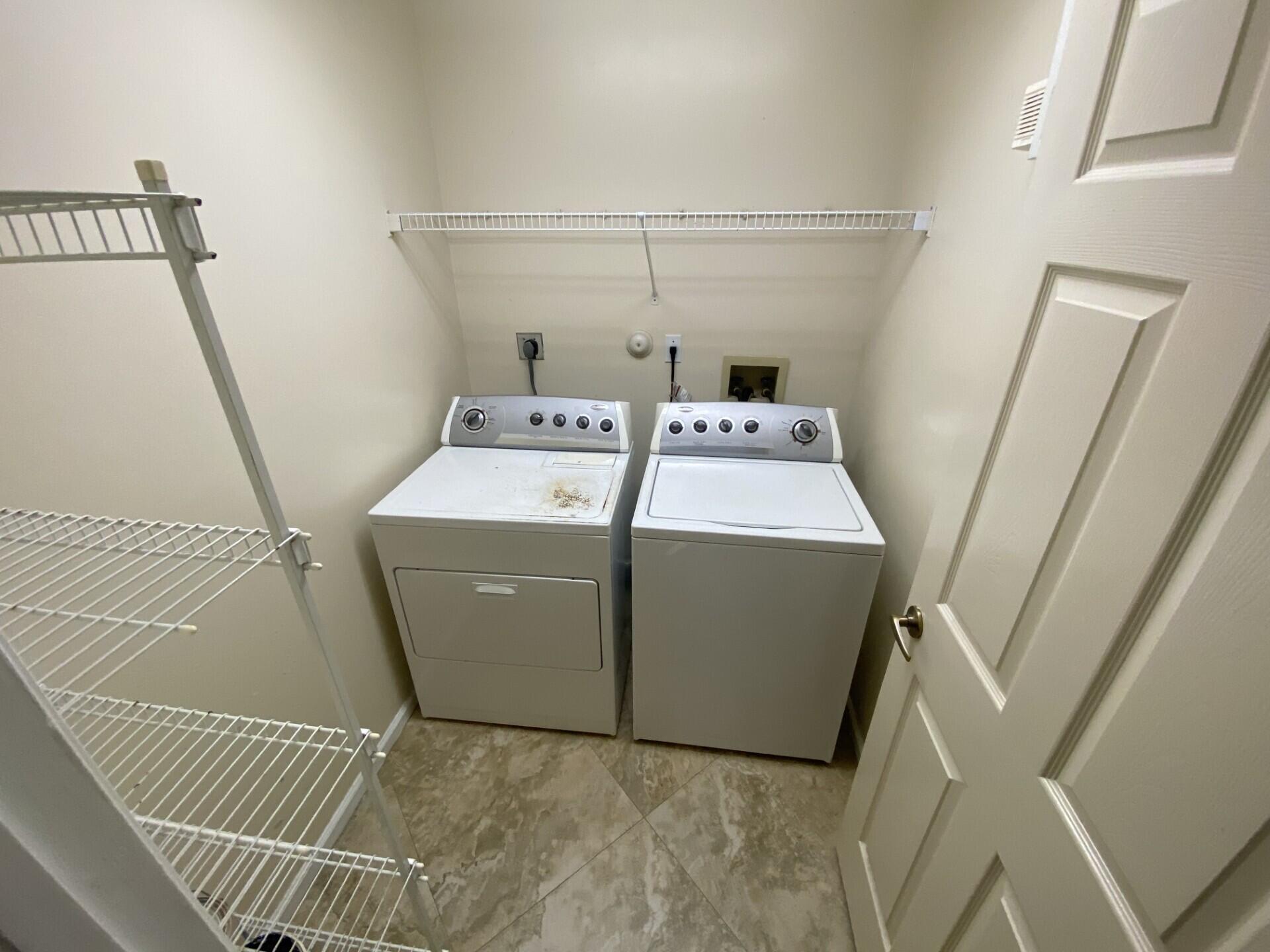 1051 Aviary Road Wellington, FL 33414 - Photo 3 of 10 a utility room with dryer and washer