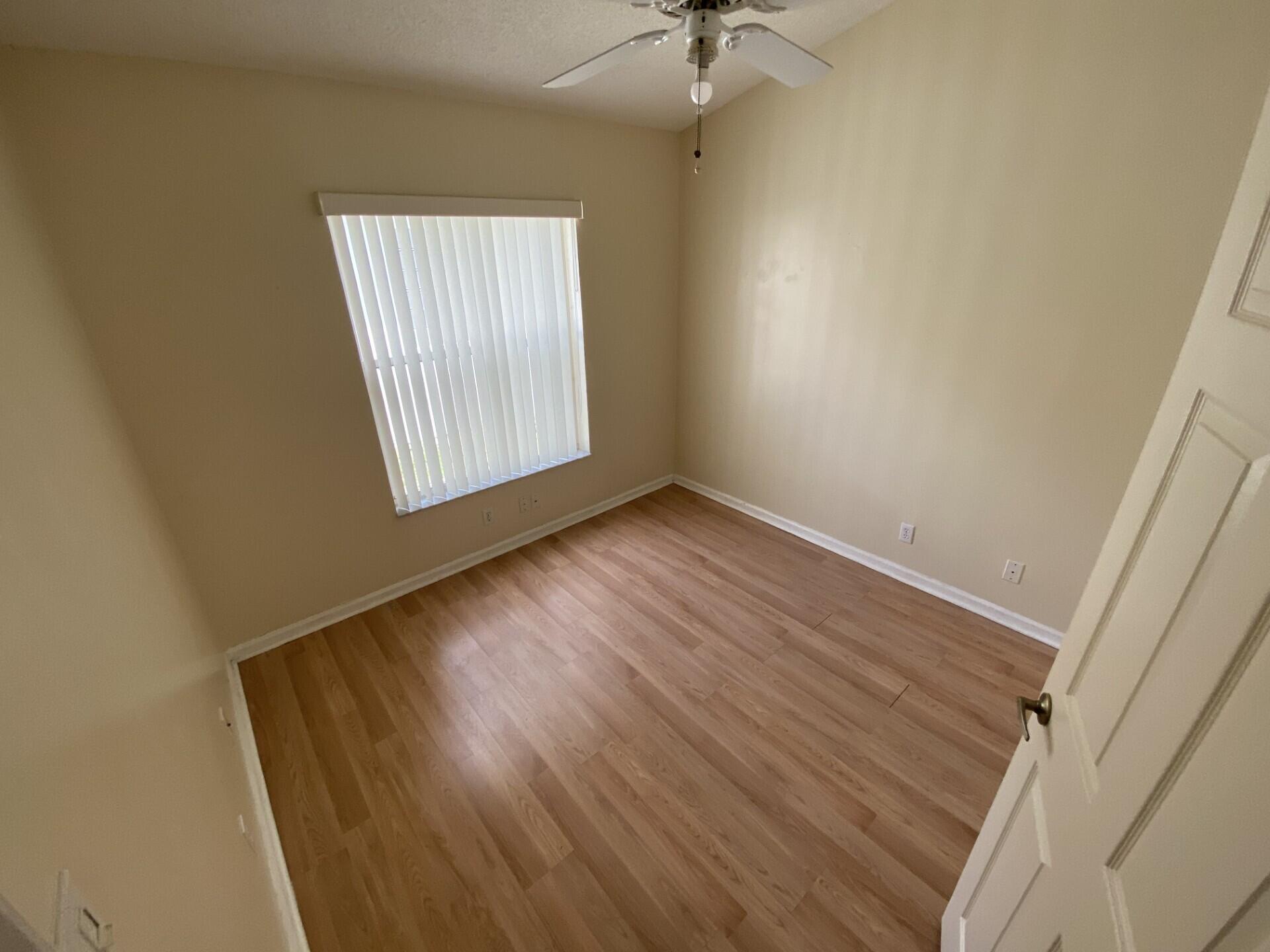 1051 Aviary Road Wellington, FL 33414 - Photo 6 of 10 an empty room with a window