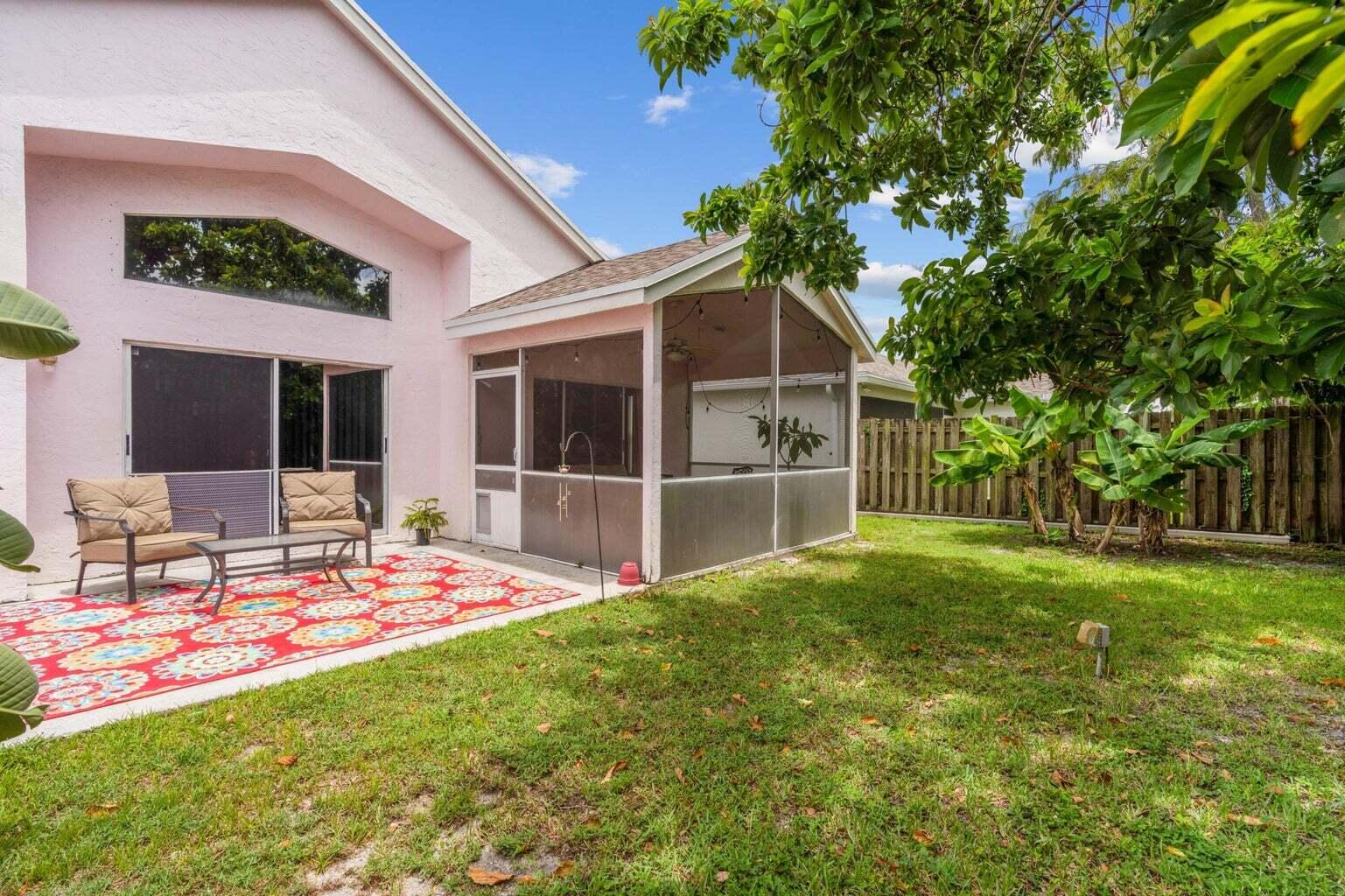 1051 Aviary Road Wellington, FL 33414 - Photo 10 of 10 a view of a house with backyard and sitting area