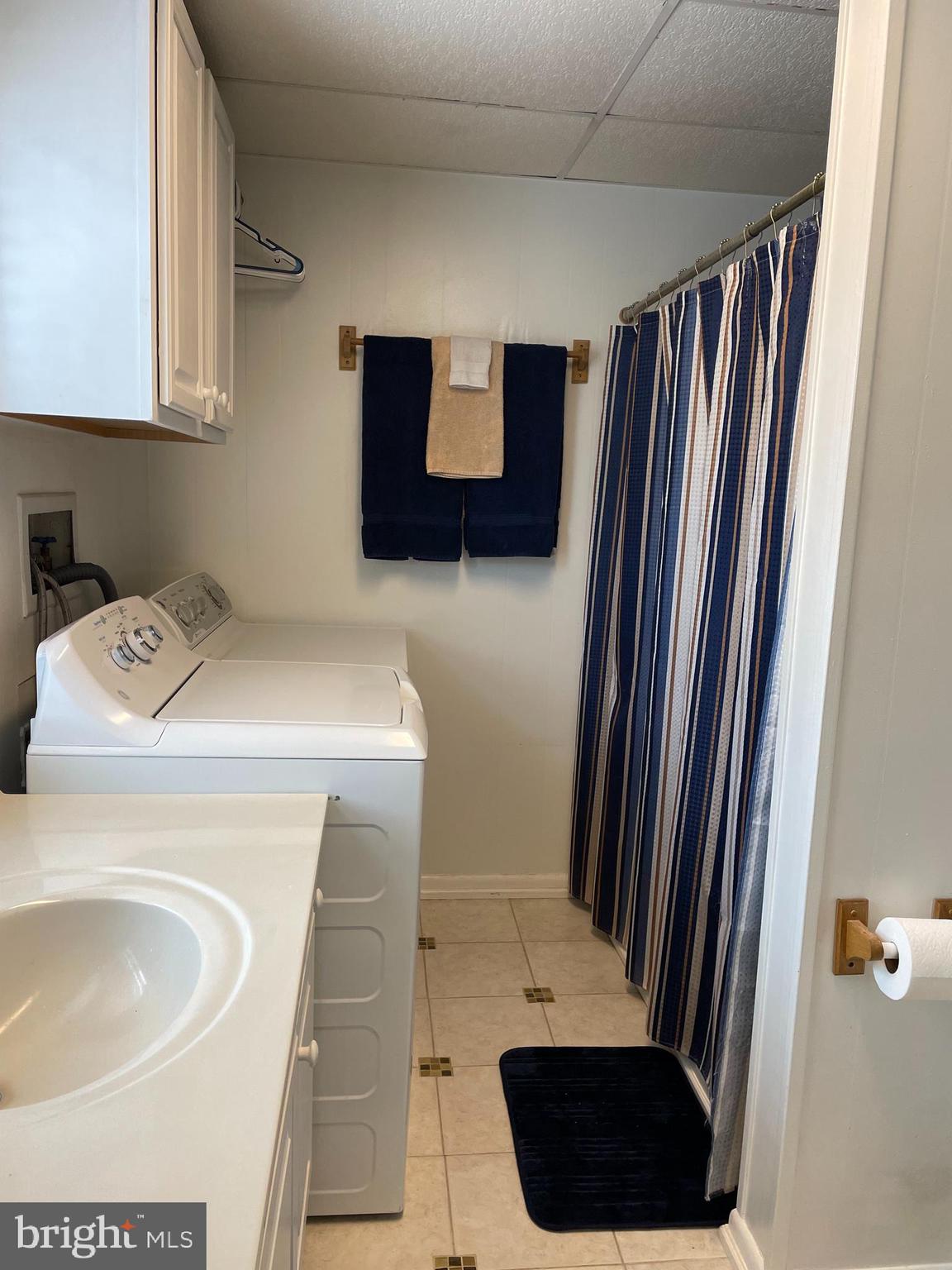 31459 Railway Road Ocean View, DE 19970 - Photo 8 of 37 first floor full bath with tub and laundry