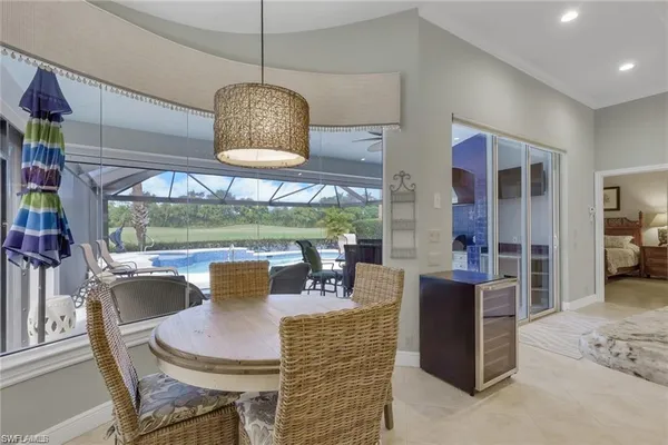 a dining room with furniture window and outside view