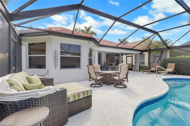 a view of a swimming pool with a patio