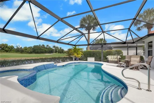 a view of indoor pool and sitting area