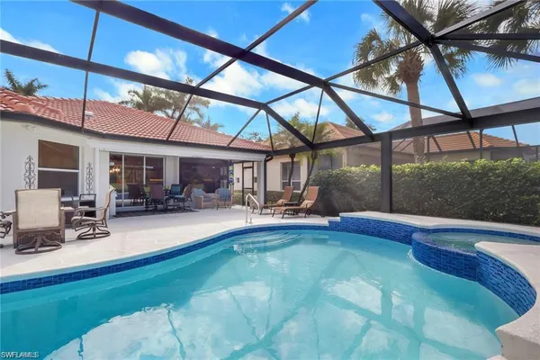 a view of a lake with houses in the back
