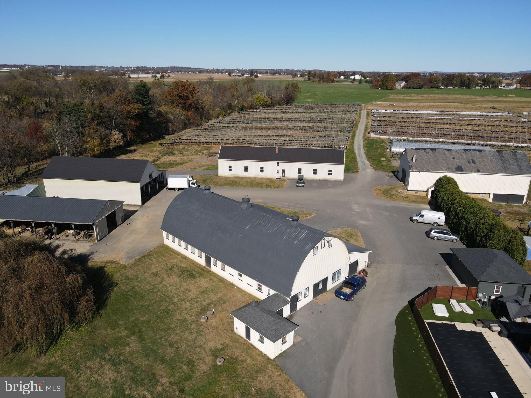 a view of a patio with lawn chairs