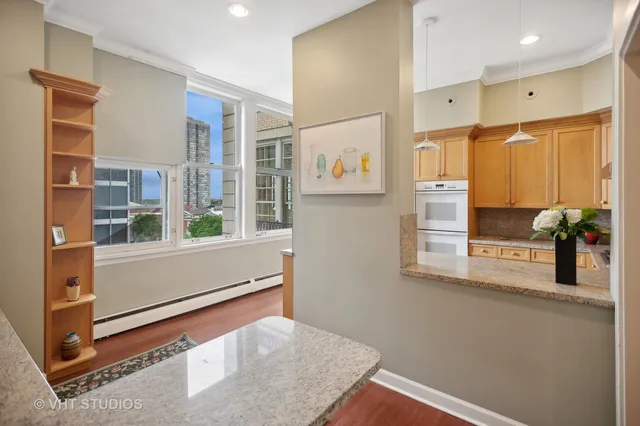 a kitchen with stainless steel appliances counter space and windows