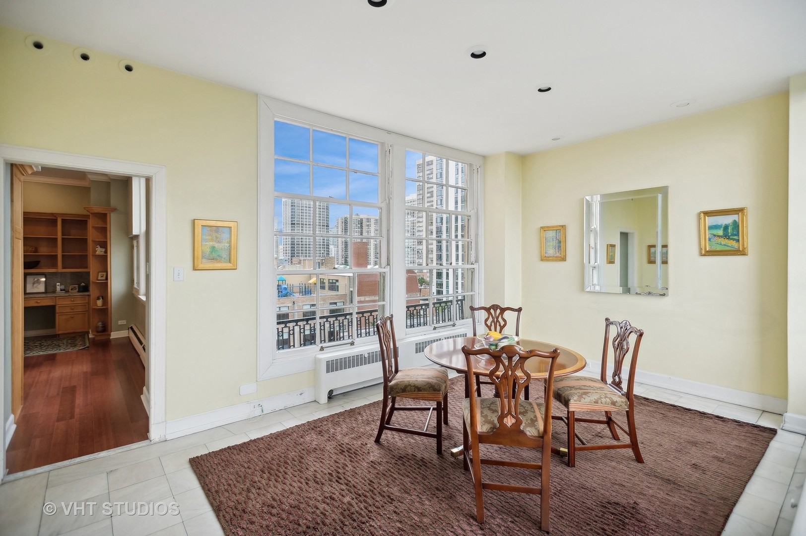 1550 North State Parkway, Unit 501 Chicago, IL 60610 - Photo 6 of 20 a dining room with wooden floor and a rug