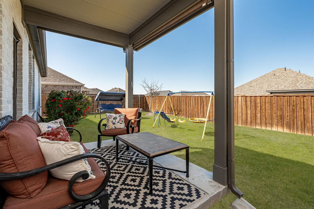 4017 Mapleleaf Pass Melissa, TX 75454 - Photo 27 of 32 a balcony with chairs and a table