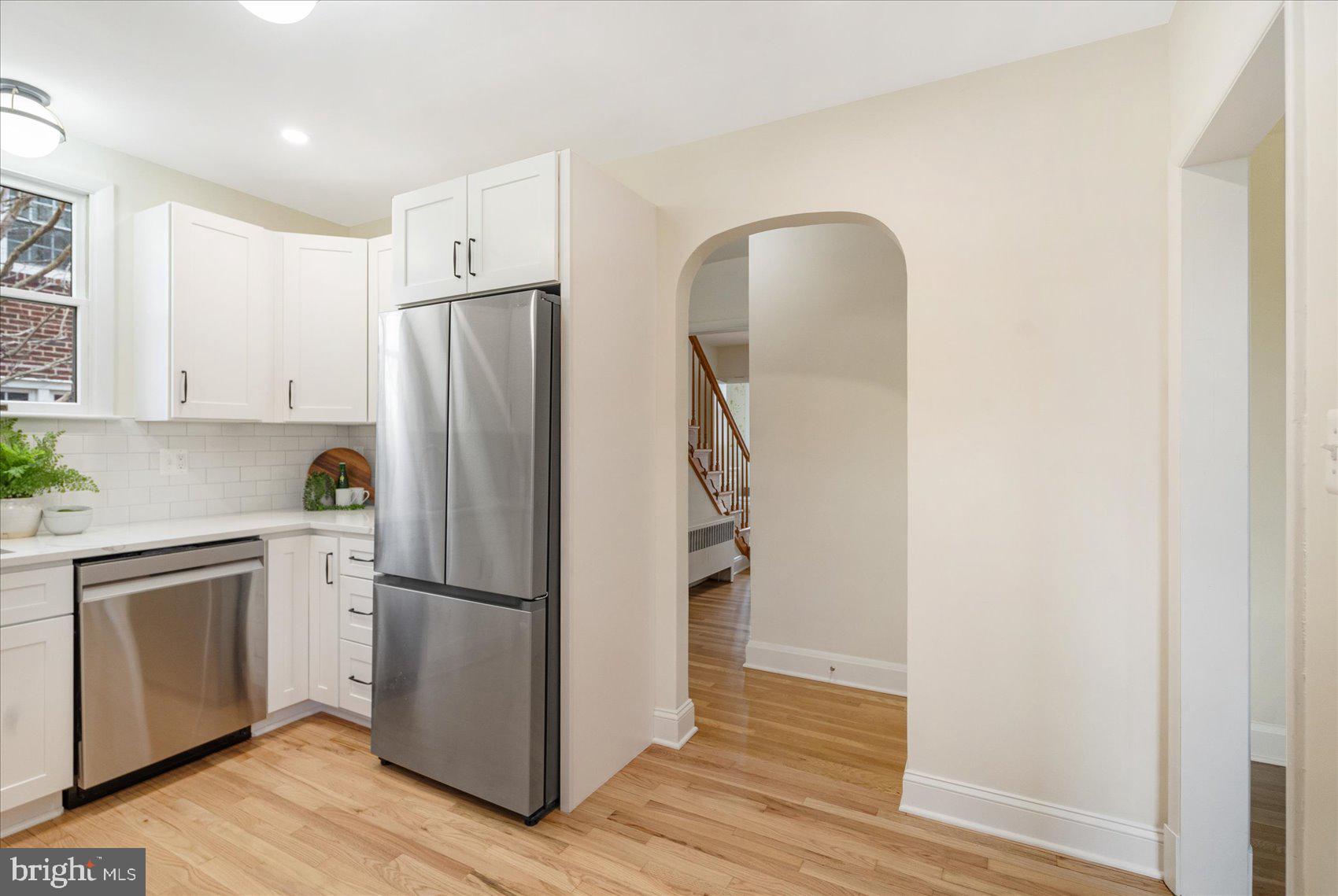 500 Wilton Road Baltimore, MD 21286 - Photo 18 of 57 a kitchen with stainless steel appliances a refrigerator and wooden floor