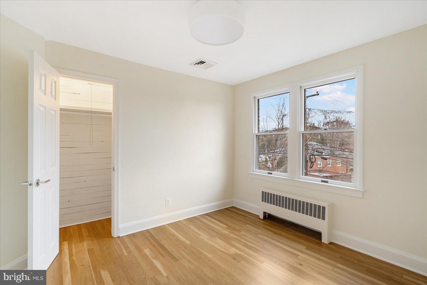 500 Wilton Road Baltimore, MD 21286 - Photo 33 of 57 an empty room with wooden floor and windows