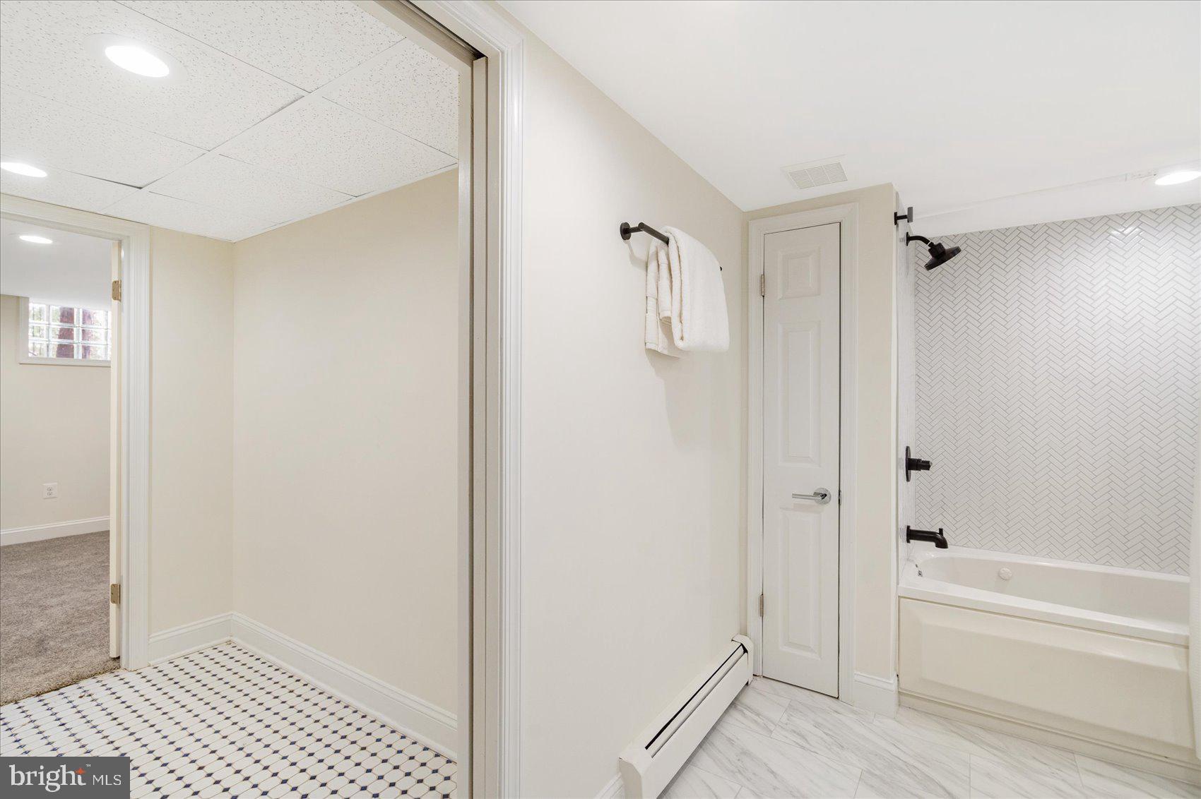 500 Wilton Road Baltimore, MD 21286 - Photo 44 of 57 a bathroom with a bathtub and a shower