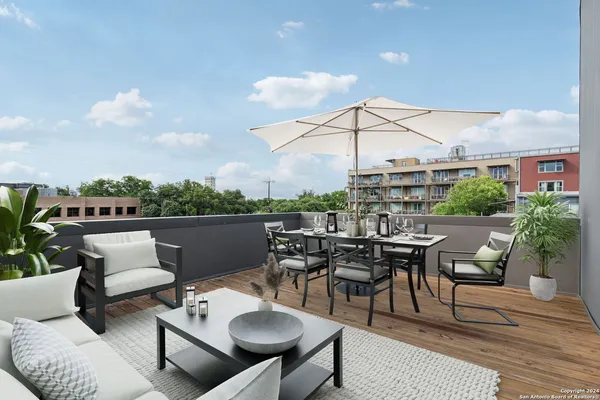 a view of a terrace with furniture