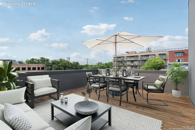 a view of a terrace with furniture