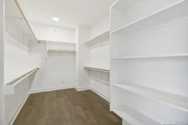 a view of an empty walk in closet