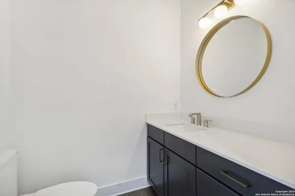 a room with a sink and cabinets