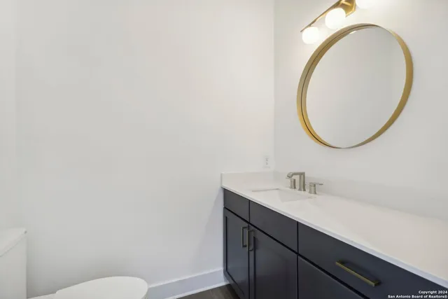 a room with a sink and cabinets