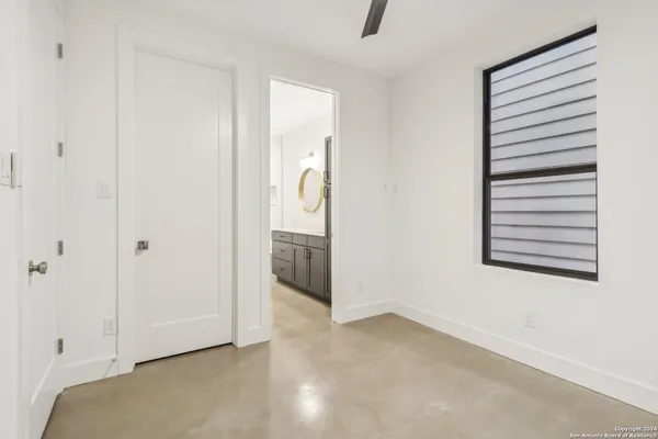 a kitchen with stainless steel appliances a kitchen island hardwood floor sink stove and refrigerator