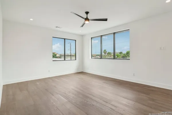 a bedroom with a bed and a couch