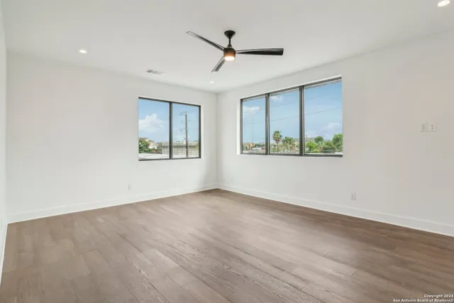 a bedroom with a bed and a couch