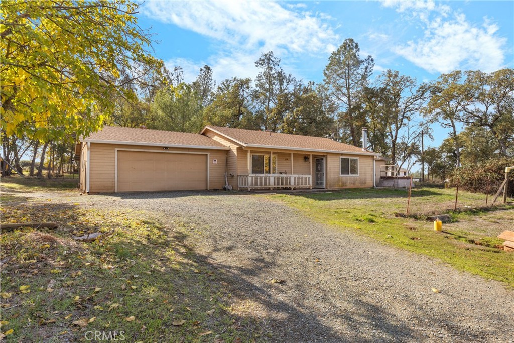 3080 Grubbs Road Oroville, CA 95966 - Photo 1 of 1 a front view of a house with a yard and garage