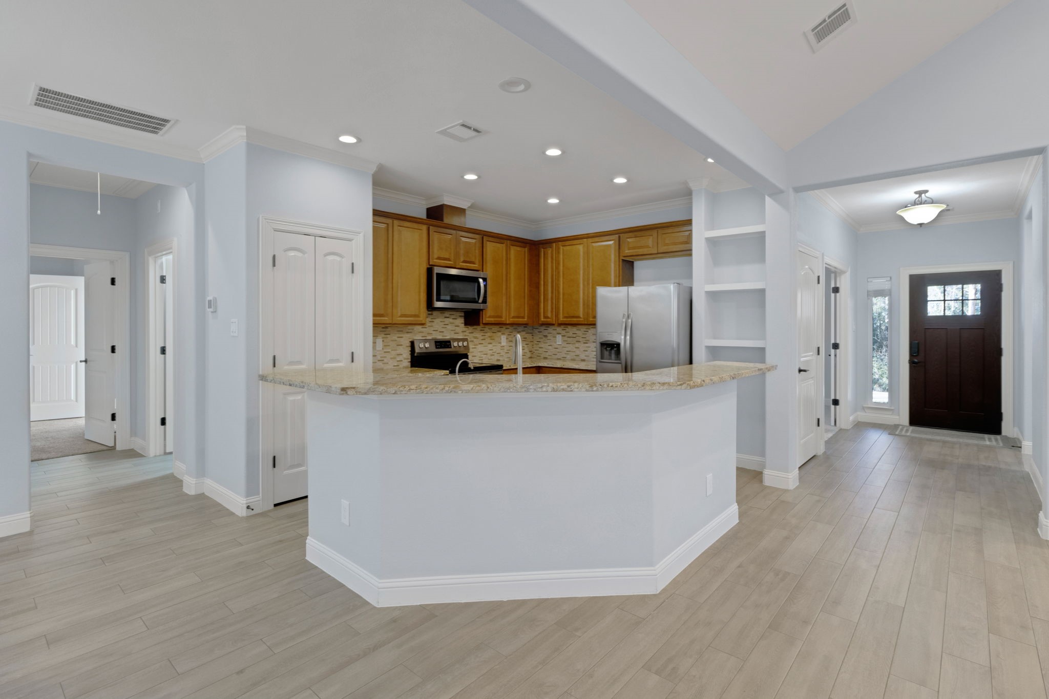 30 Beachwood Way Coldspring, TX 77331 - Photo 14 of 47 a living room with stainless steel appliances kitchen island furniture and wooden floor