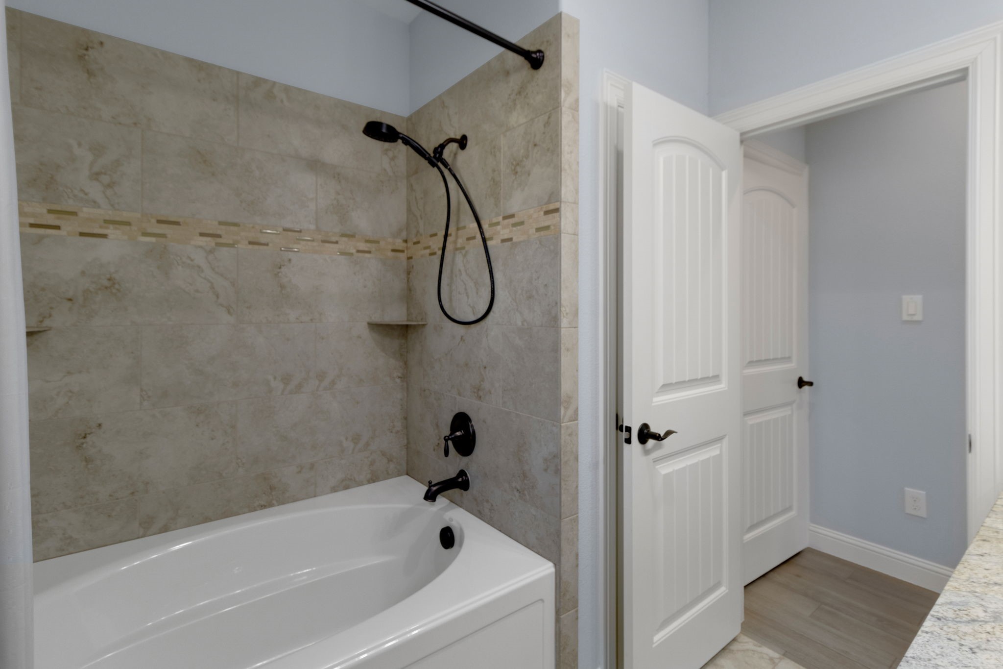 30 Beachwood Way Coldspring, TX 77331 - Photo 26 of 47 a bathroom with a bath tub with a shower