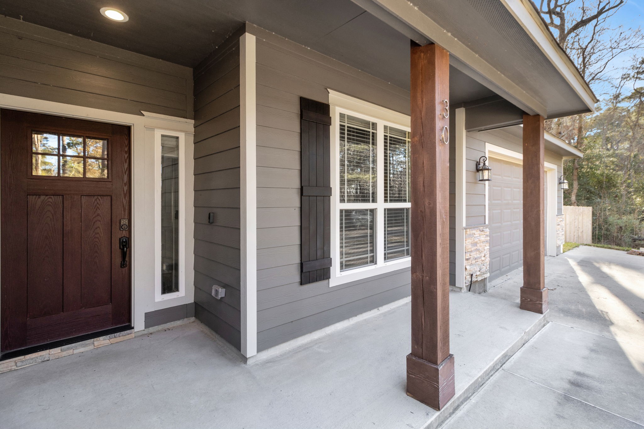 30 Beachwood Way Coldspring, TX 77331 - Photo 3 of 47 a view of livingroom with a large window and wooden fence