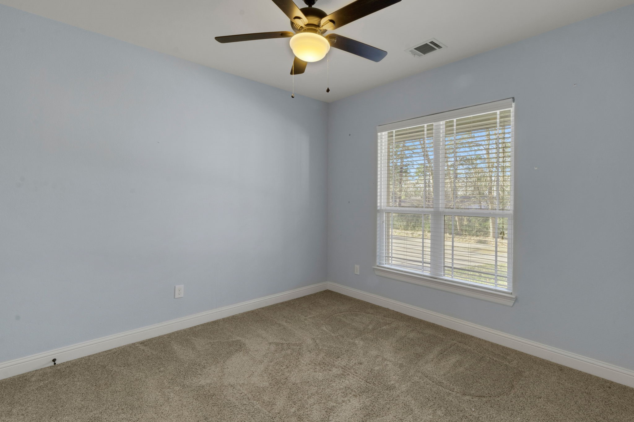 30 Beachwood Way Coldspring, TX 77331 - Photo 31 of 47 an empty room with a window and a fan