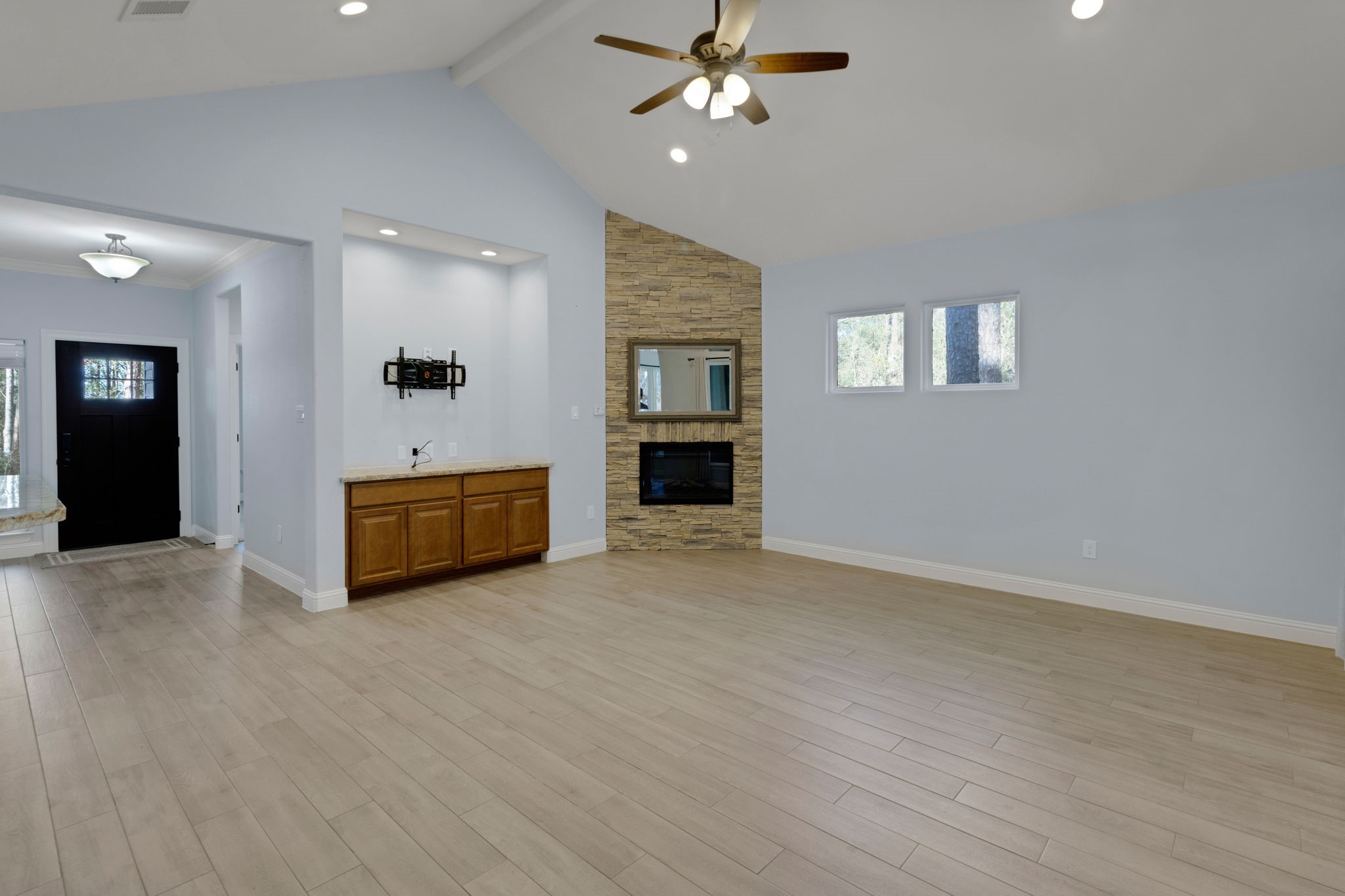 30 Beachwood Way Coldspring, TX 77331 - Photo 4 of 47 a view of an empty room with a window and a kitchen