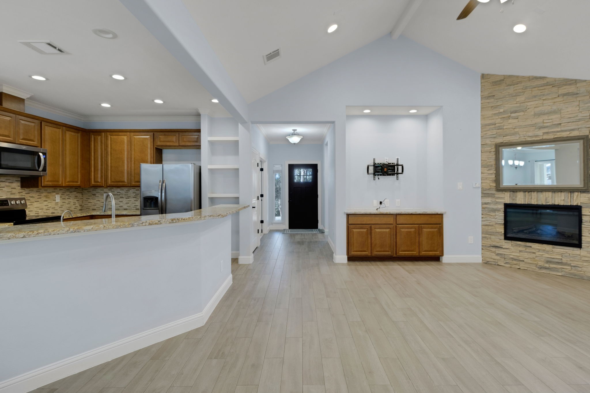 30 Beachwood Way Coldspring, TX 77331 - Photo 10 of 47 a view of kitchen with sink a refrigerator and a stove top oven