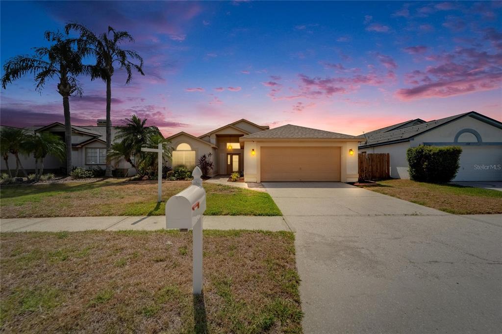 1601 Westerly Drive Brandon, FL 33511 - Photo 1 of 1 a front view of a house with a yard and potted plants