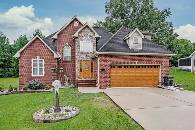 a front view of a house with a yard